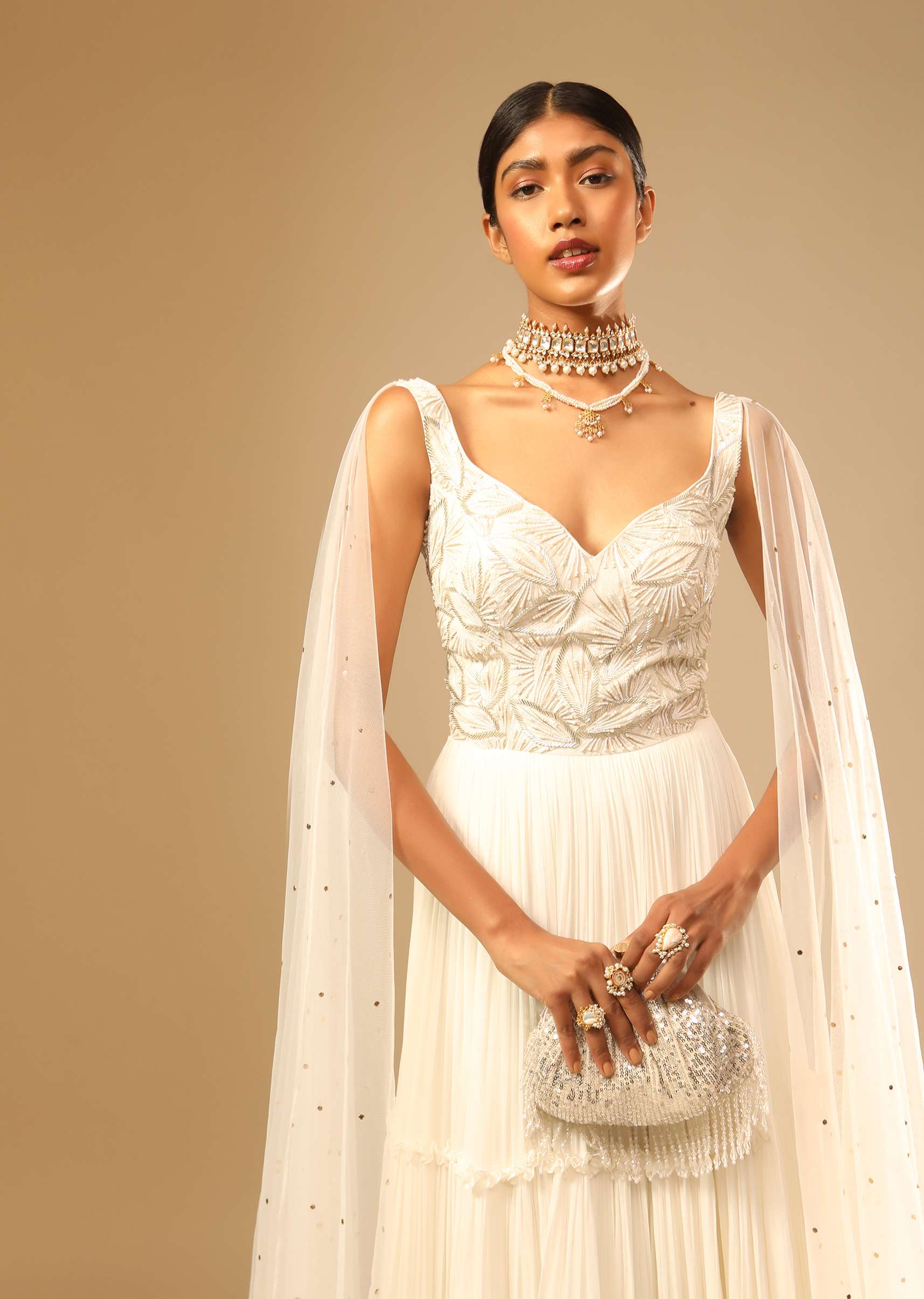 Off White Gown In Georgette With Tiered Flare And Hand Embroidered Leaf Motifs On The Bodice - Image 4