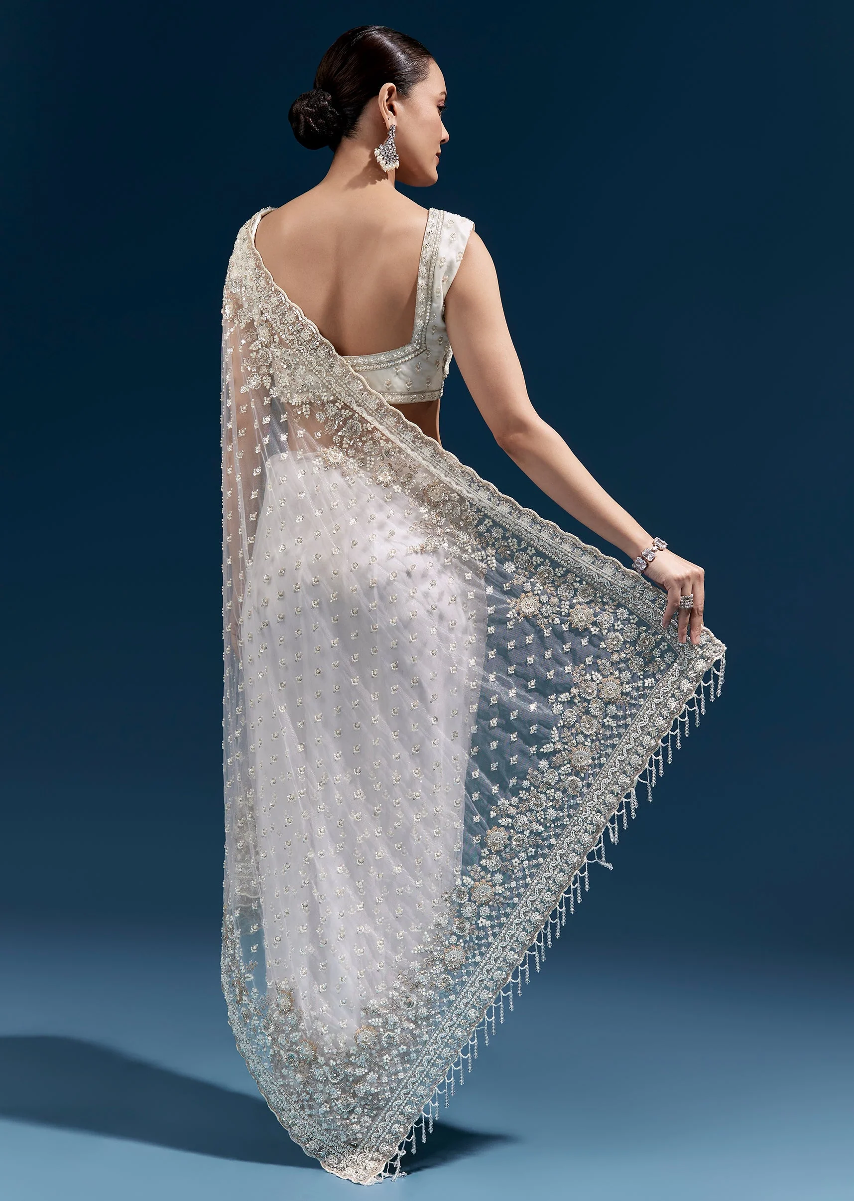 Off White Heavy Embroidered Net Saree With Scalloped Border And Tasselled Pallu - Image 4