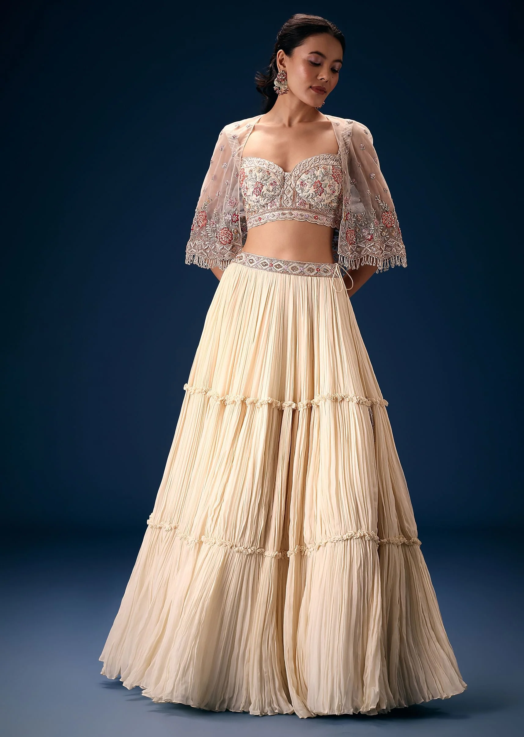 Off White Tiered Lehenga With Embroidered Corset Blouse And Embroidered Cape - Image 3